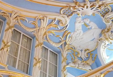 Describe at least three characteristics of Rococo art, and let's dive into a whimsical discussion about its influence on modern design.